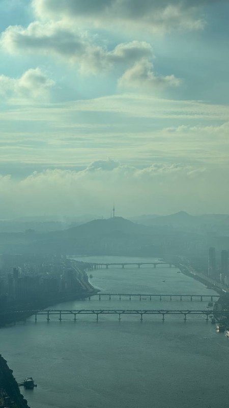 The Han River and bridges seen from far above in grey-green haze